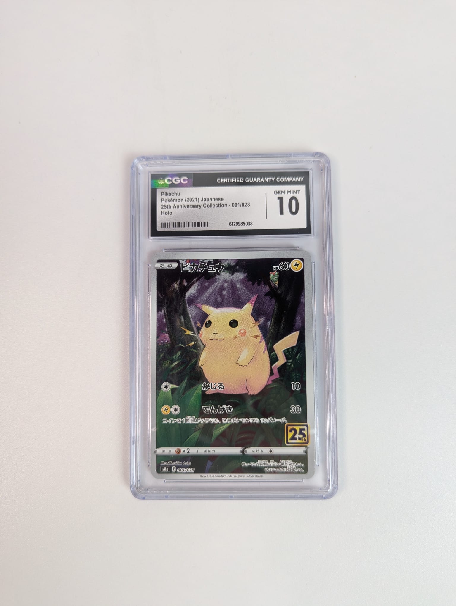 Pokémon trading card in a protective CGC 10 Slab with a white background